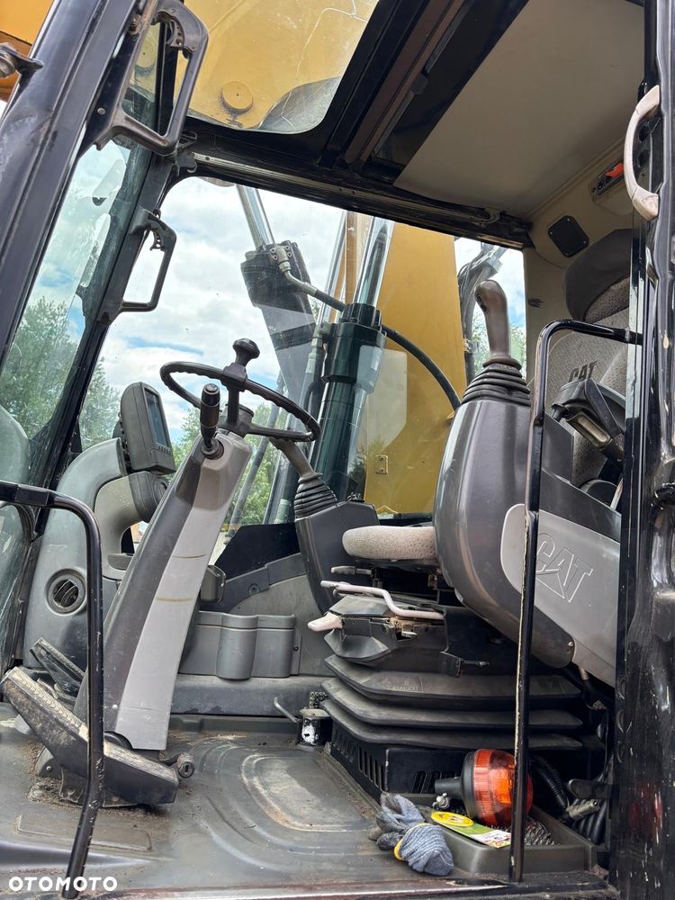 Caterpillar M315D rok 2010r podpory, chwytak obrotowy - 13