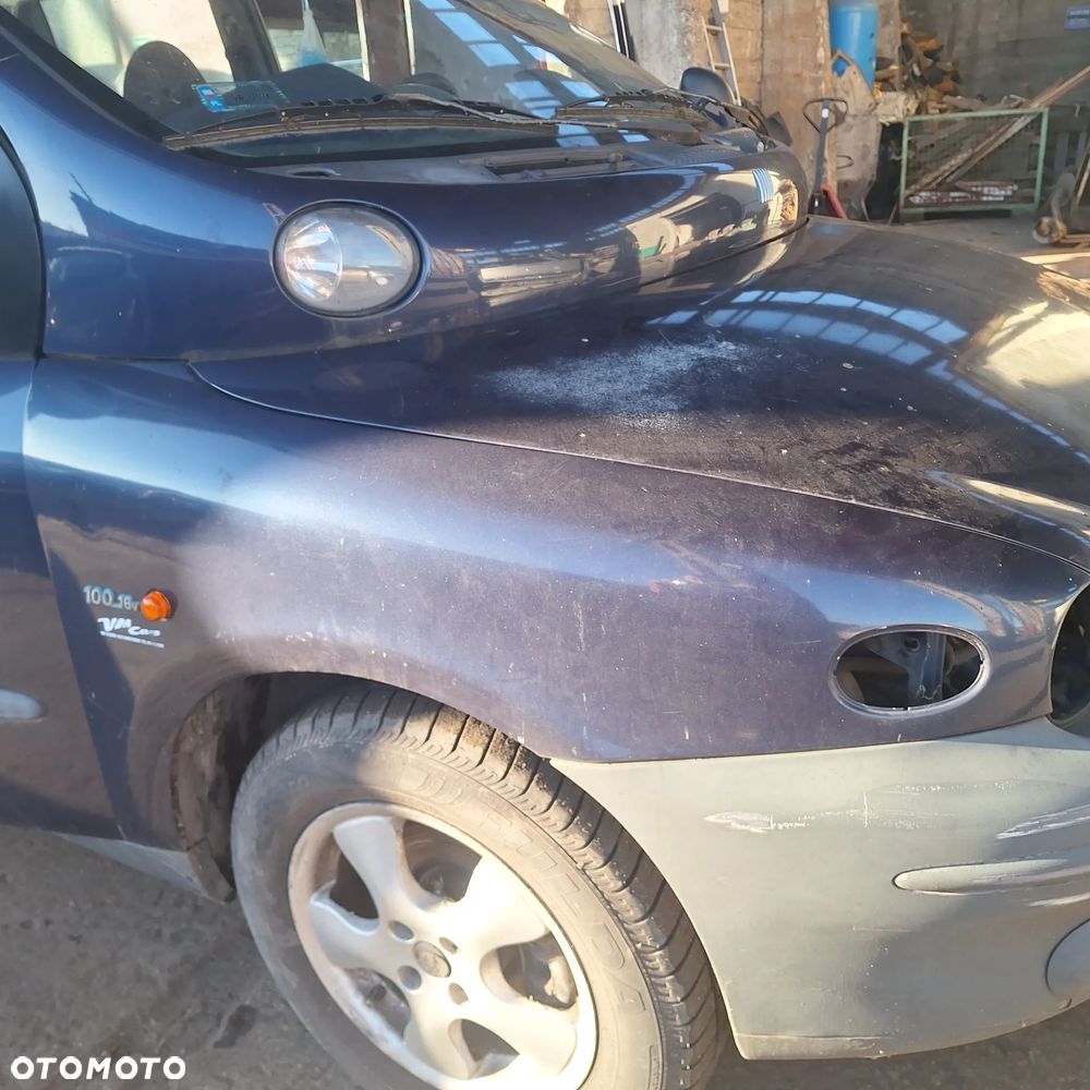 MASKA ZDERZAK DRZWI BLOTNIK LAMPY SZYBA CZESCI MULTIPLA 339/7 - 11