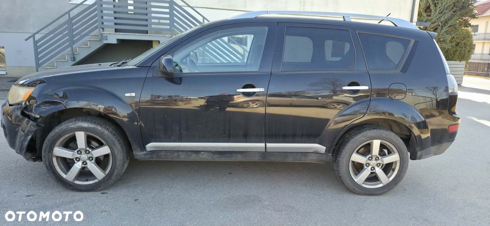 MITSUBISHI OUTLANDER II 2,0DID 140KM piasta zwrotnica lewy przód - 2