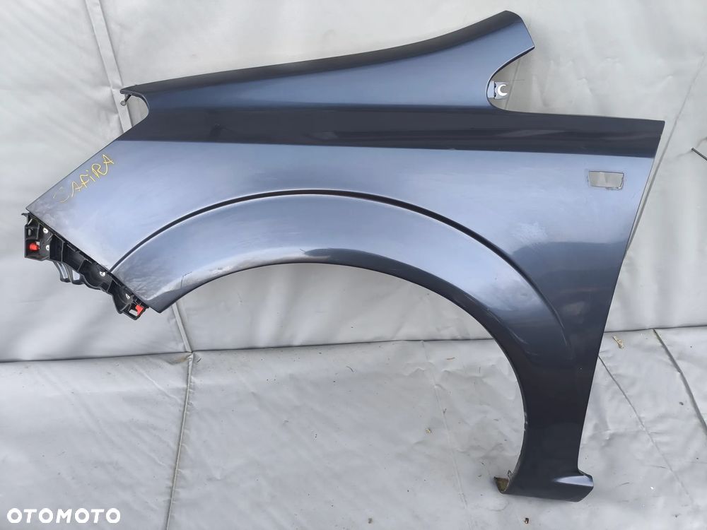 OPEL ZAFIRA B BŁOTNIK PRZEDNI LEWY