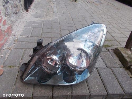 TOYOTA COROLLA VERSO LIFT 07- CIEMNA LEWA PRZEDNIA LAMPA ORYGINAŁ - 1