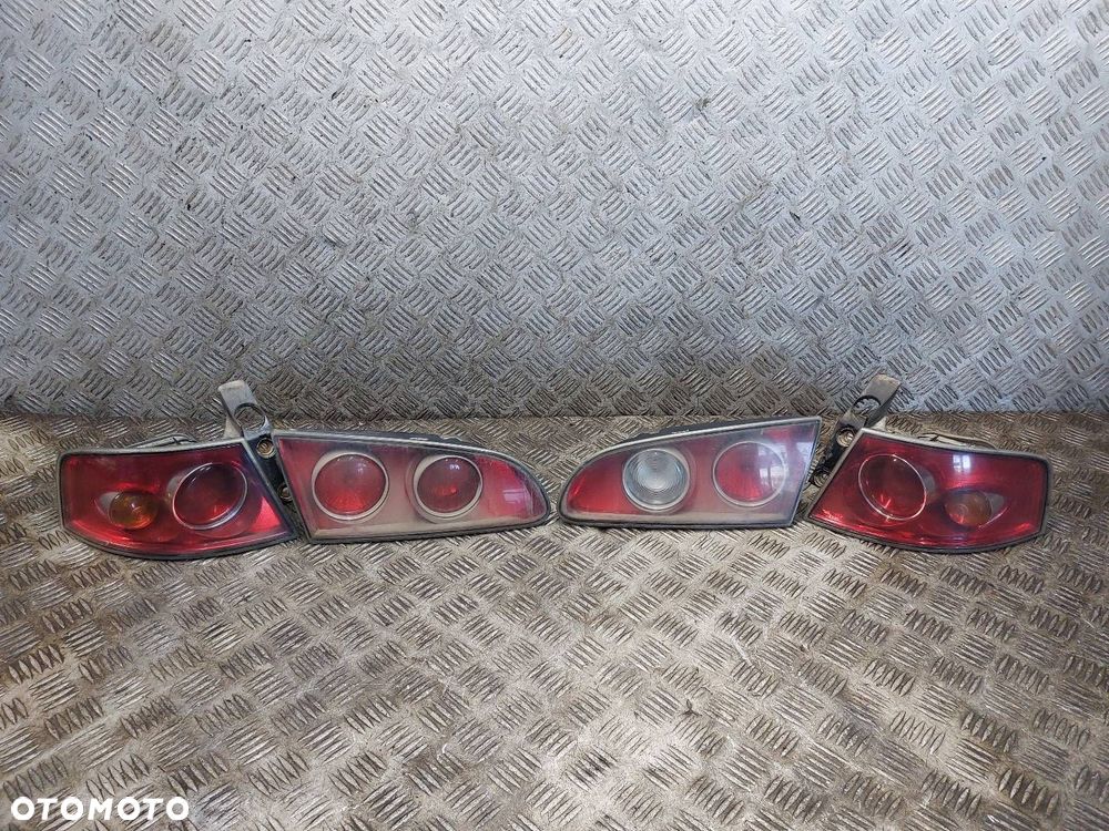 LAMPA LEWY TYŁ + PRAWY TYŁ W KLAPĘ W BŁOTNIK KOMPLET SEAT IBIZA III - 1