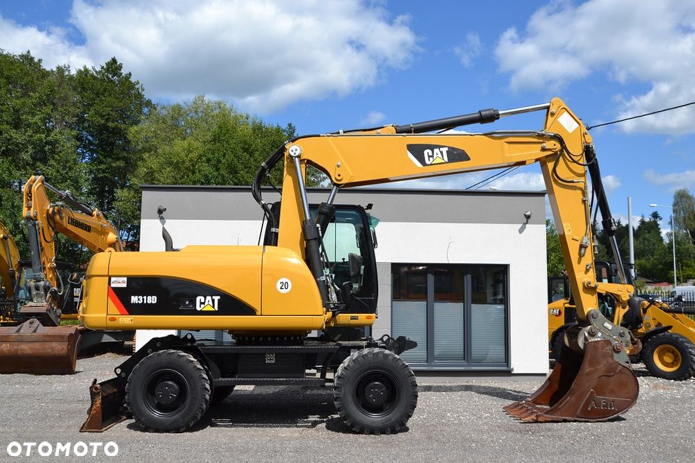 Caterpillar 318 D - 12