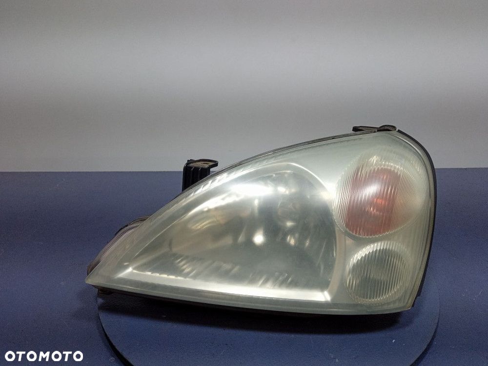SUZUKI LIANA REFLEKTOR LEWY LAMPA PRZEDNIA EU 100-32662 - 1