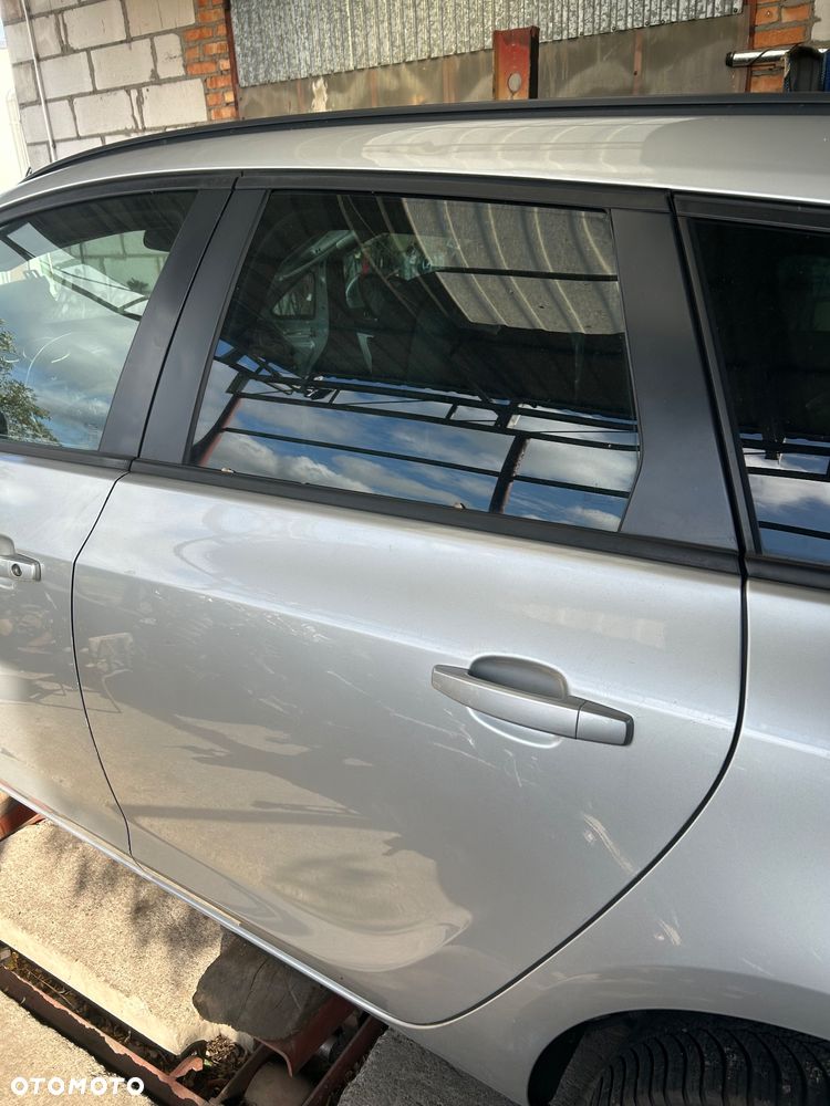 Drzwi lewy tył kombi kompletne Opel  Astra J Z176 - 2