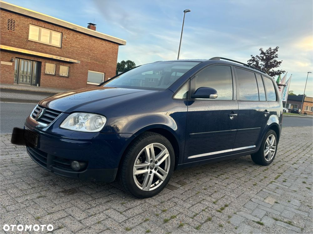Volkswagen Touran 1.9 TDI Highline DSG - 1