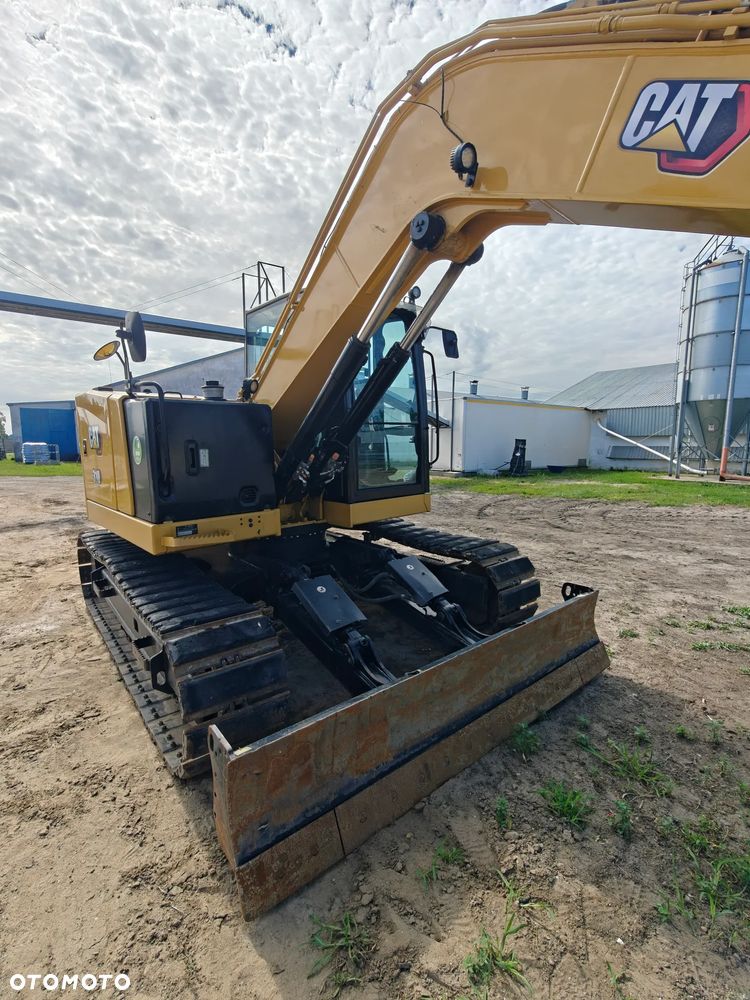Caterpillar 310 - 9