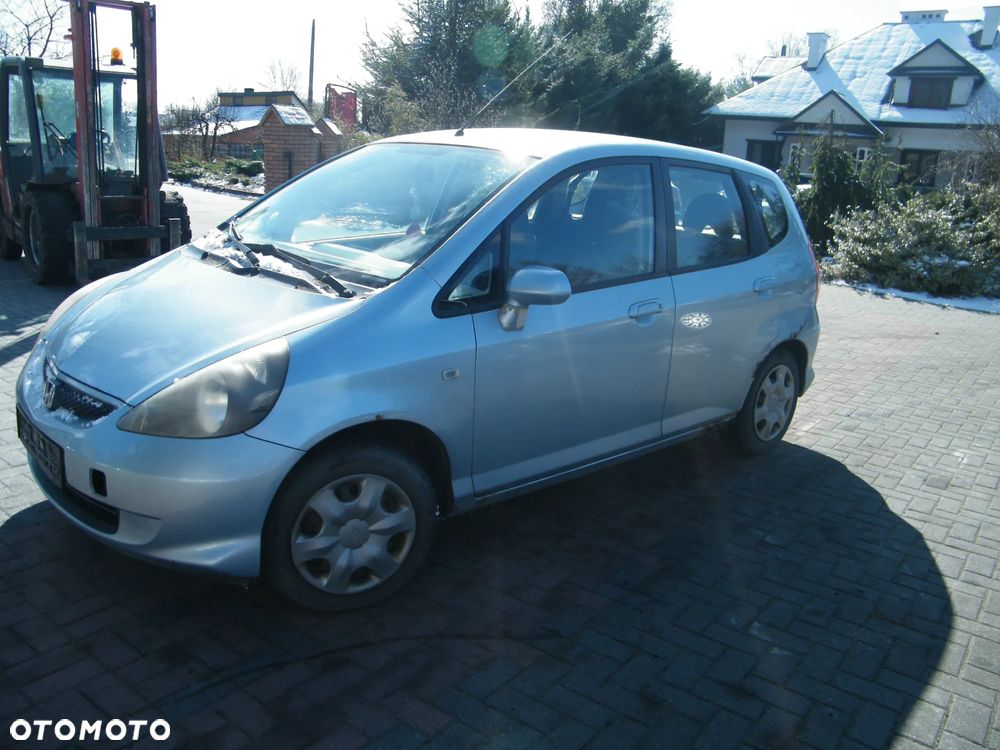 Honda Jazz II FL (04-08r.) 1.2 i-DSI 77KM. Silnik L12A4 Skrzynia SWLM lakier B528M. Cały na części. GWARANCJA !!!  Przód Tył Zestaw Komplet Drzwi Klapa Zderzak Błotnik Maska Grill Atrapa Szyba Pas Lampa Lusterko Boczki Fotel Kanapa Kokpit Deska Rozdzielcza Przełącznik Włącznik Sterownik Przewody Wiązka Instalacja Moduł Komputer Czujnik Listwa Pompa Alternator Wtryski Głowica Rozrusznik Kompresor Sprzęgło Dwumas Silnik Skrzynia ABS Klimatyzacji Paliwa Wspomagania Kolektor Turbina Przepustnica Zawór Chłodnica Koło Hak Belka Sanki Zawieszenie Mcpherson Półoś Amortyzator Wydech Tłumik Zacisk Most - 7