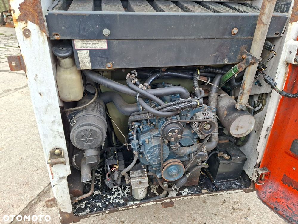 Bobcat 553 4X4 + Melroe Ingersoll-Rand 725S B/H - 39