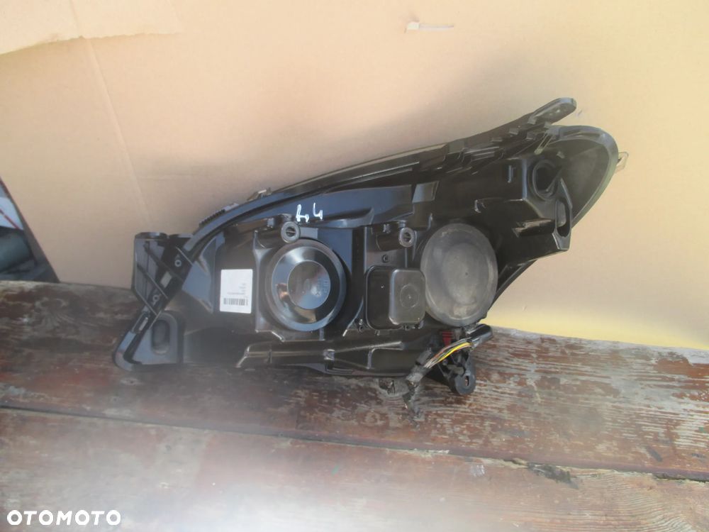lampa prawa Opel Astra 3 H Hella Europa - 4