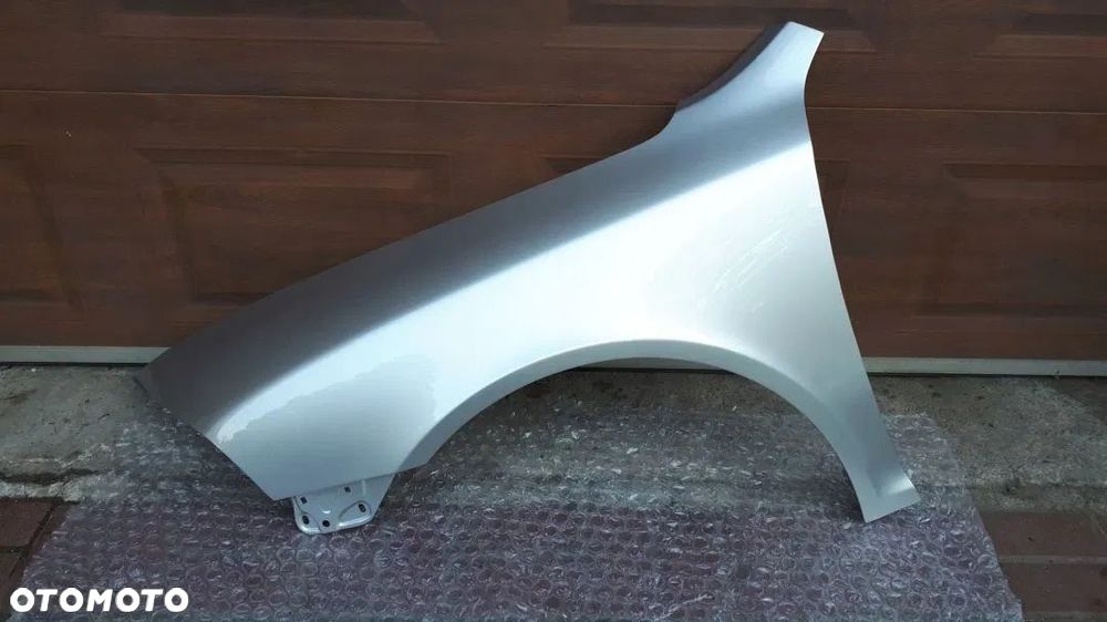 Skoda Octavia 2 II 2004-2008 Błotnik przód lewy 9102