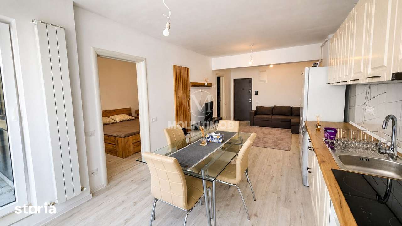 Studio spatios 42,67 mp + balcon 9 mp, Etaj 2 | Parcare subterană — fotografia 1