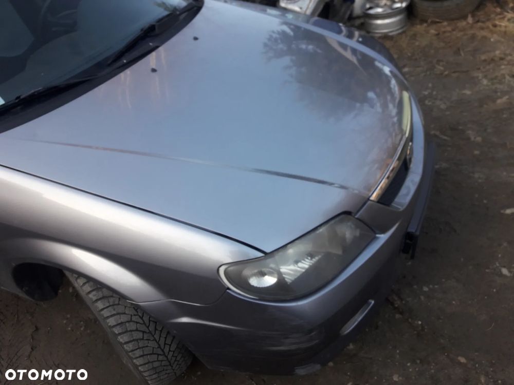 Mazda 323 323f BJ 01-03 Lift  Maska lampa zderzak pas atrapa 22V - 7