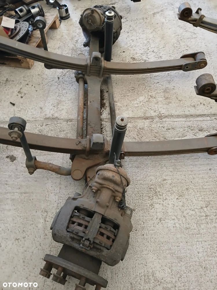 OŚ PRZEDNIA KOMPLETNA  RENAULT MIDLIM 17,5 - 2