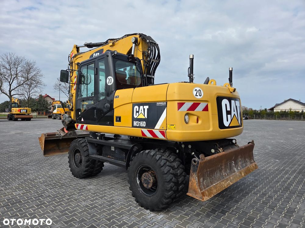 Caterpillar M 316 D / z Niemiec / Tylko 7500 mth / Instalacja pod System 3D Trimble / / - 3