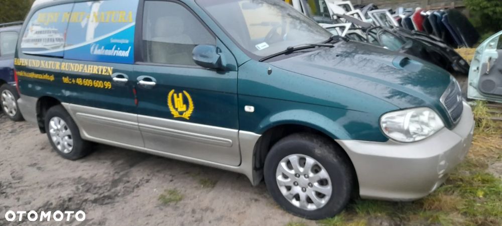 blotnik prawy lampa  Kia Carnival I  99-06r