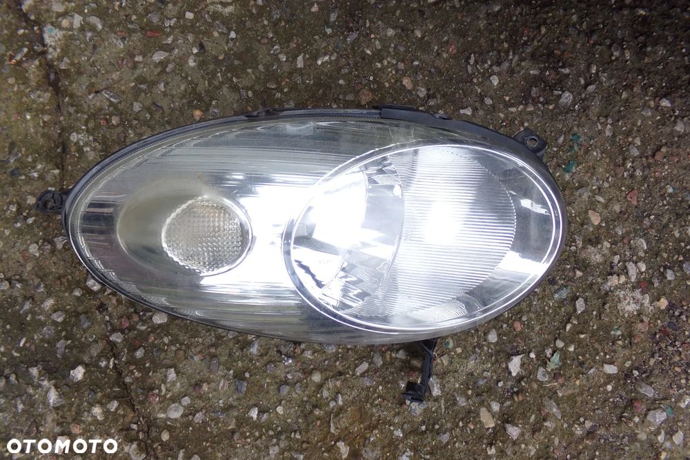 Reflektor lampa przednia lewa 26010AX700 Nissan Micra K12 KYO