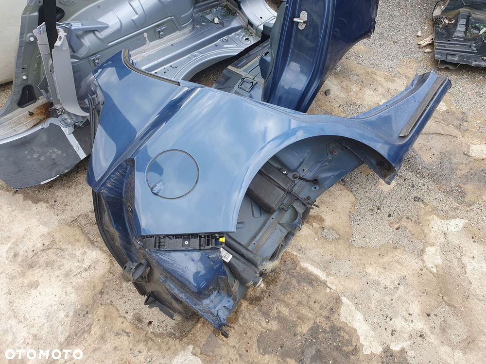 błotnik prawy tył Opel Corsa E 5d - 1