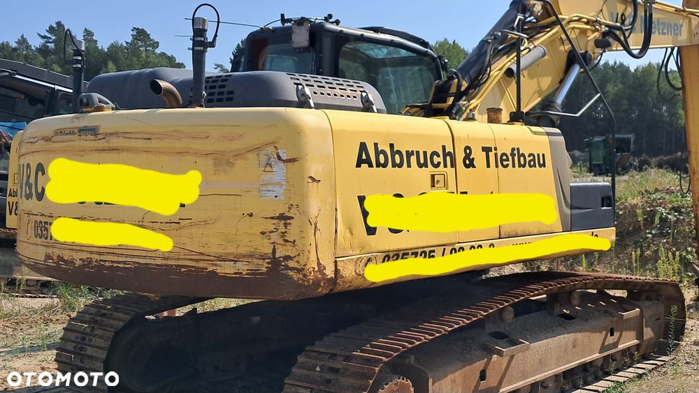 New Holland E 265 C - 3