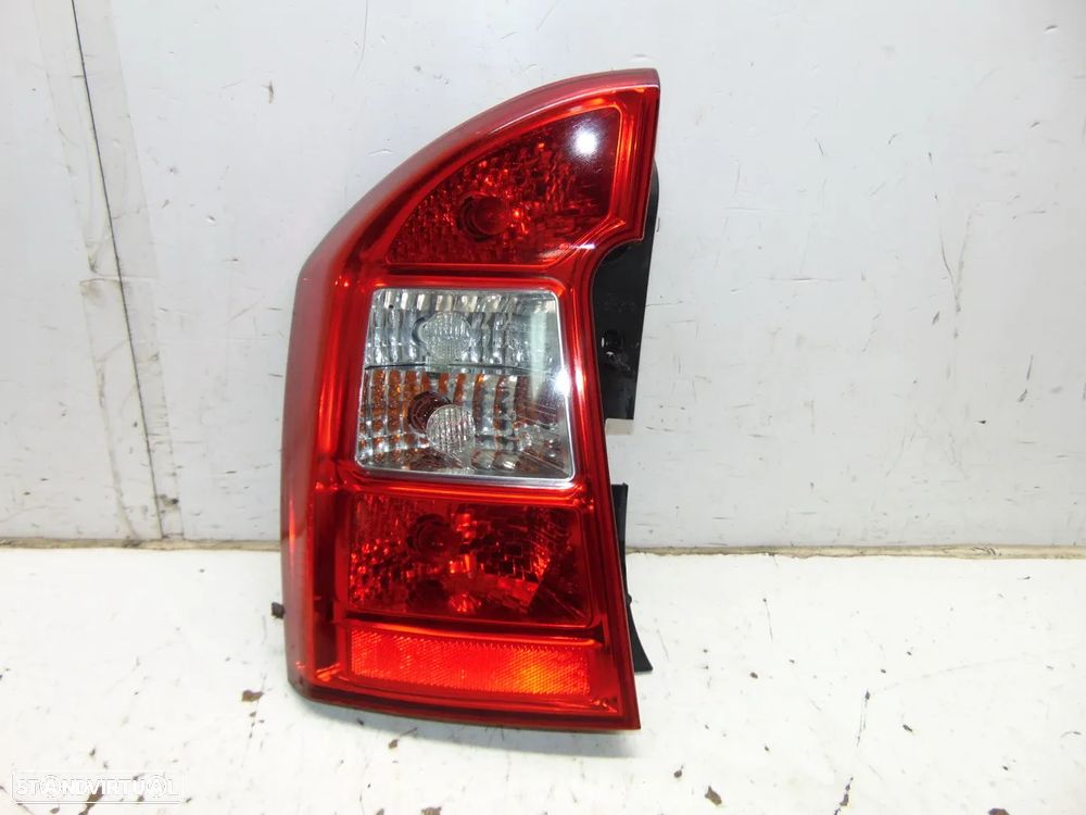 Kia Carens farolim - 1