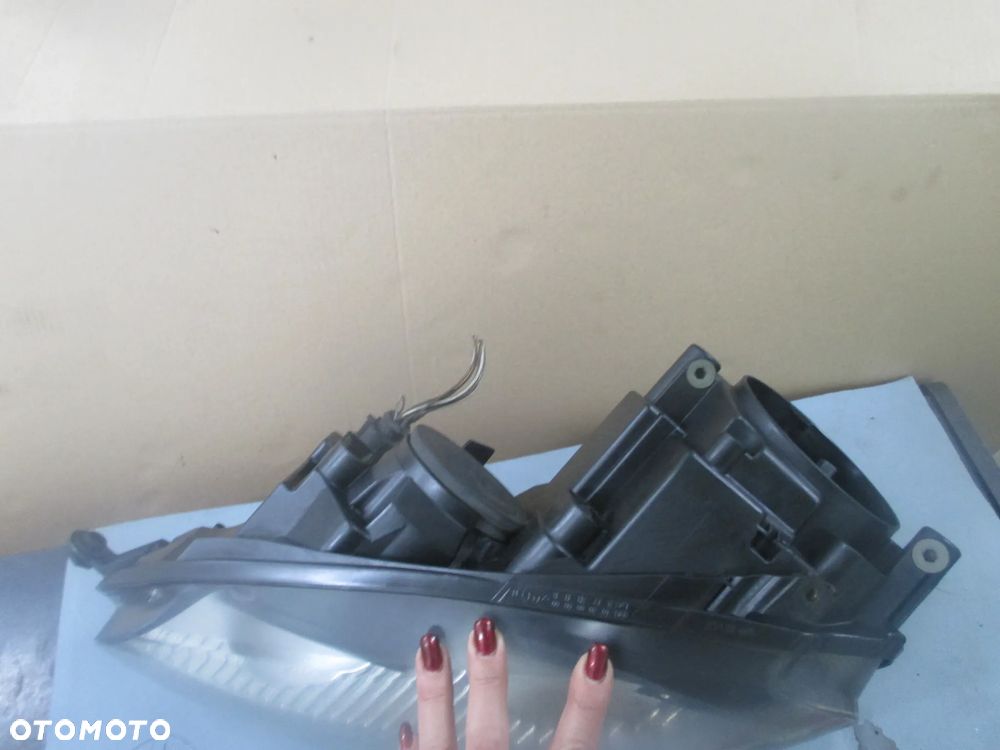 lampa lewa Golf V GT Hella Europa - 3
