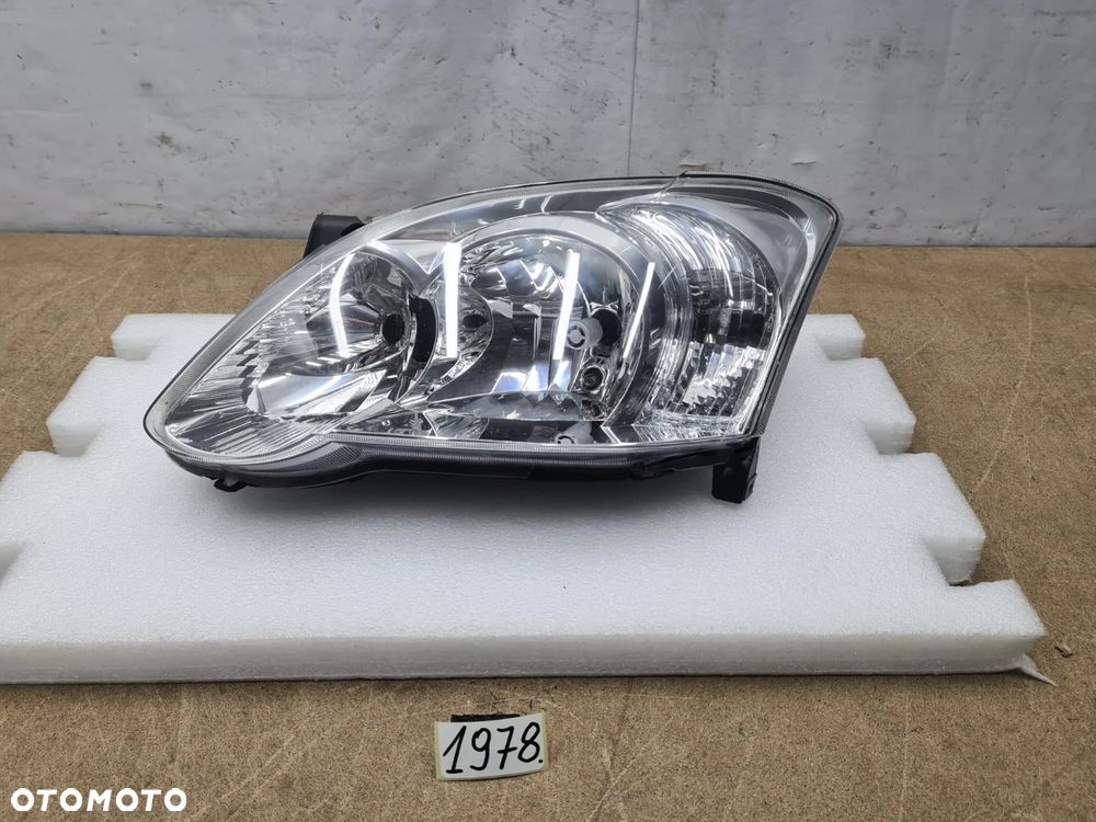 Toyota Corolla E12 04-07r 8117002380 reflektor lampa przednia przód Valeo - 1
