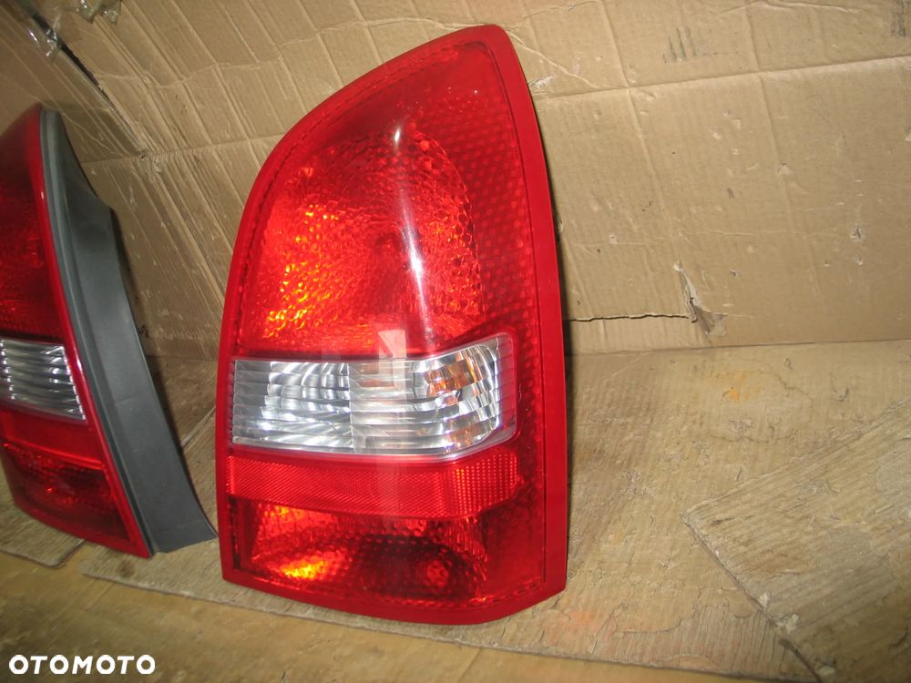 lampa tyl prawa lewa nissan primera P12 sedan oryginal - 7