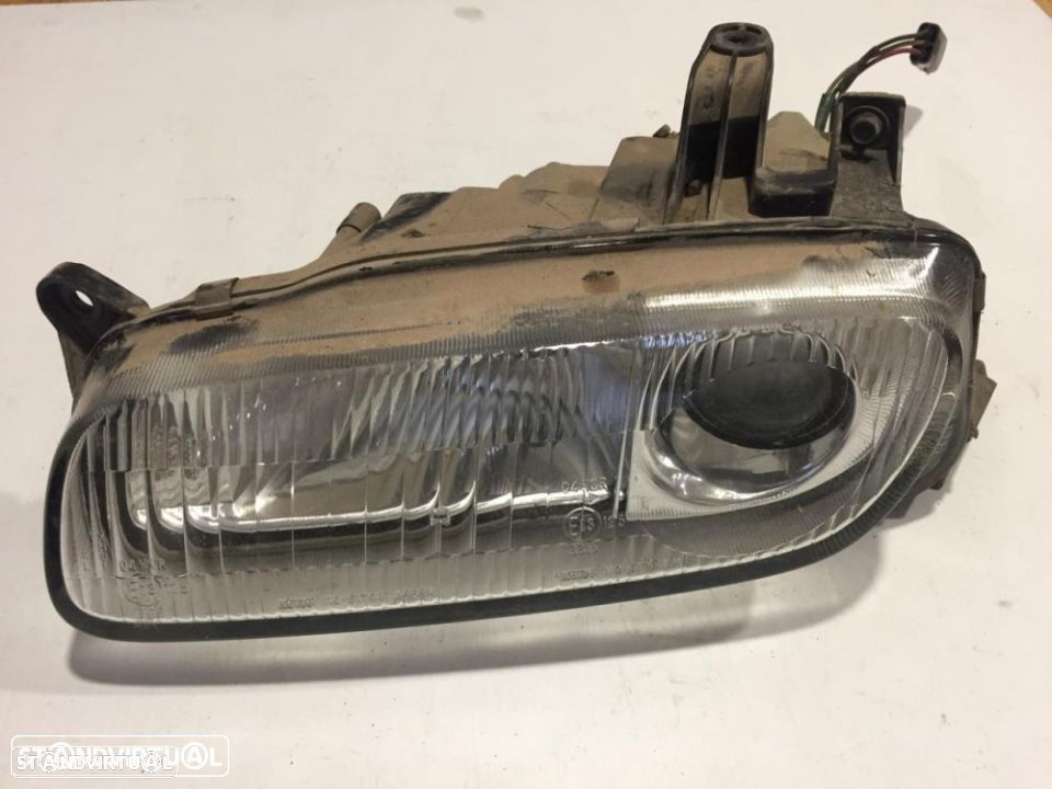 farol optica esquerdo mazda 323 F - 1