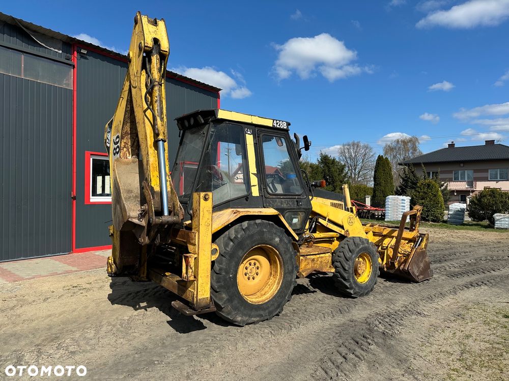 Caterpillar 428B ramię typu Banan - 11