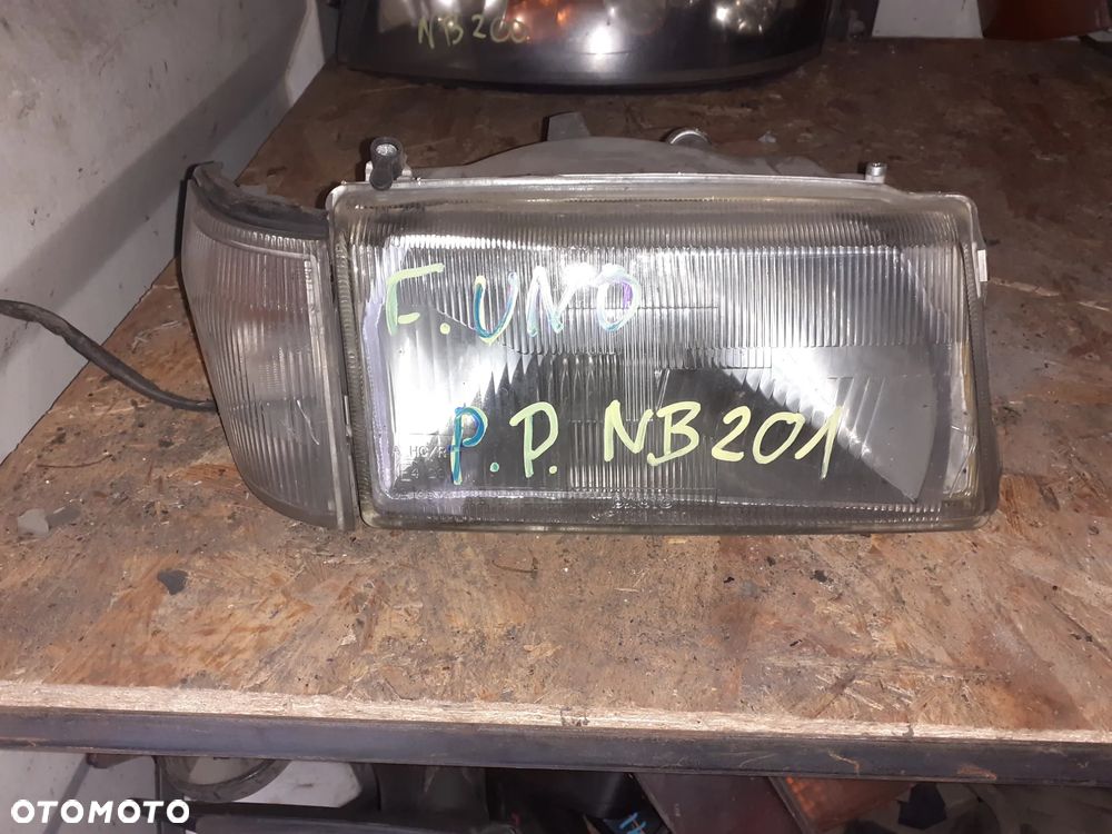 Reflektor PRAWY PRAWA LAMPA PRZÓD FIAT UNO - 1