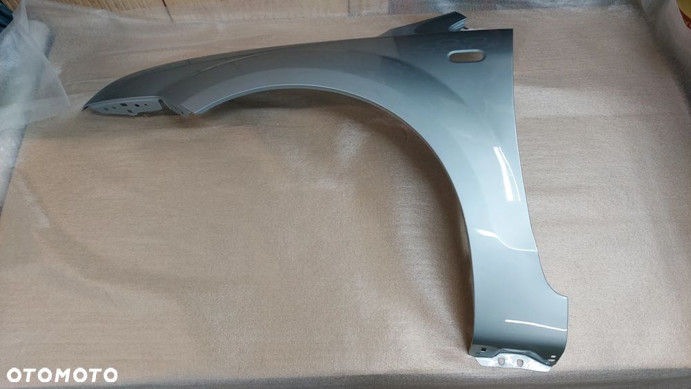 FORD FOCUS MK2 II 04-08r BŁOTNIK LEWY LUB PRAWY  Z3 TONIC BLUE  CYNK - 1