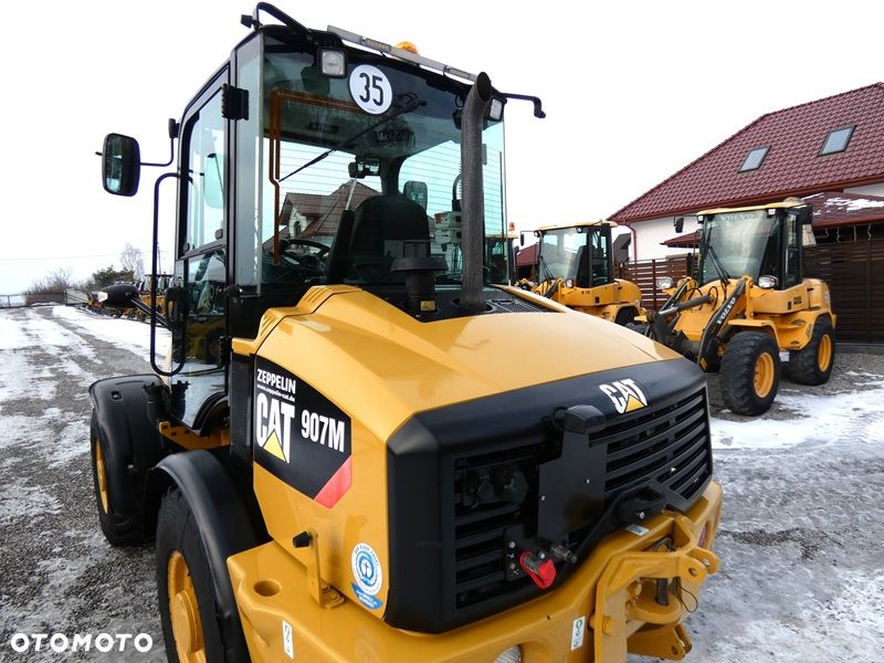 Caterpillar CAT 907M Z Niemiec / Wyjątkowo Wyposażony / 35km/h / 3.050mtg / - 23