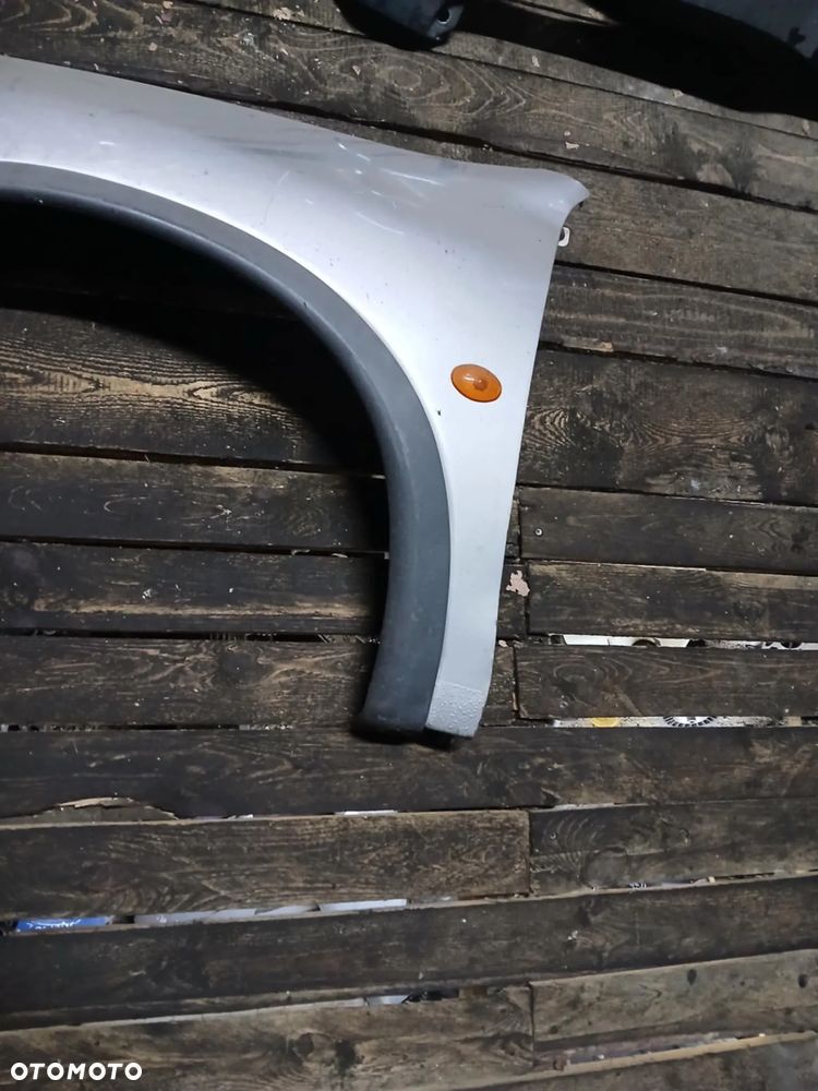 Opel Corsa B Błotnik lewy - 4