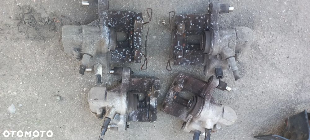 FORD FOCUS MK3 mk2  ZACISK TYLNY PRAWY LEWY TYŁ OE