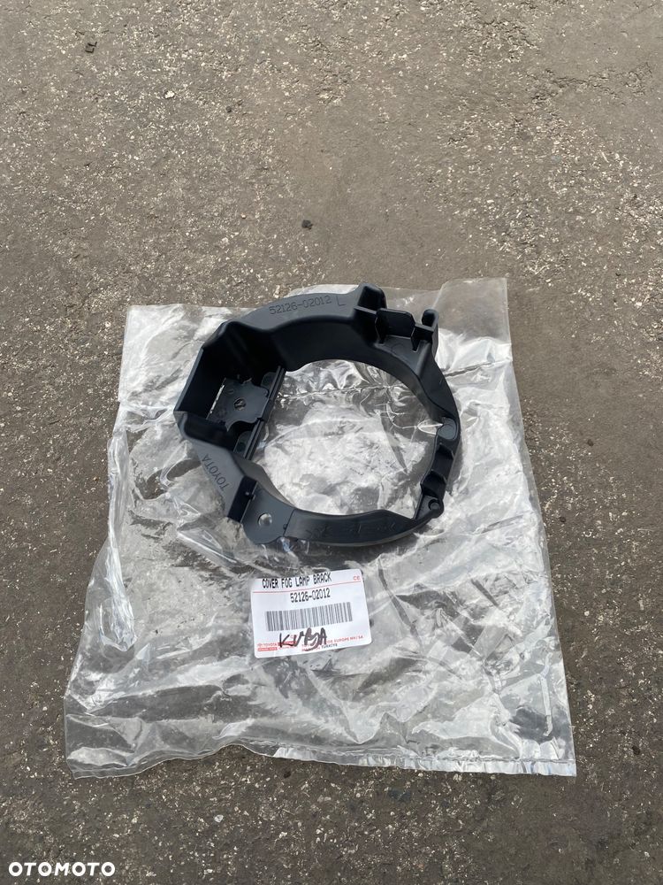 TOYOTA AURIS1 I lift Nowa ! Oryginalna ! lewa ramka lewe mocowanie koszyczek koszyk halogenu na pod halogen wspornik lewy przedni przód  52126-02012  5212602012 - 1