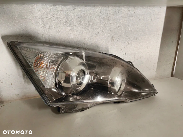 LAMPA PRAWA HONDA CR-V CRV XENON 06-12H OE 33100-SWW-G1