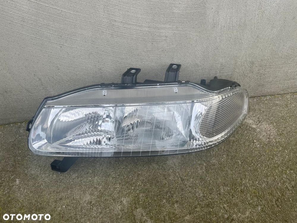 LAMPA PRZEDNIA LEWA ROVER 400  1995-2003 - NOWA CARELLO - 1