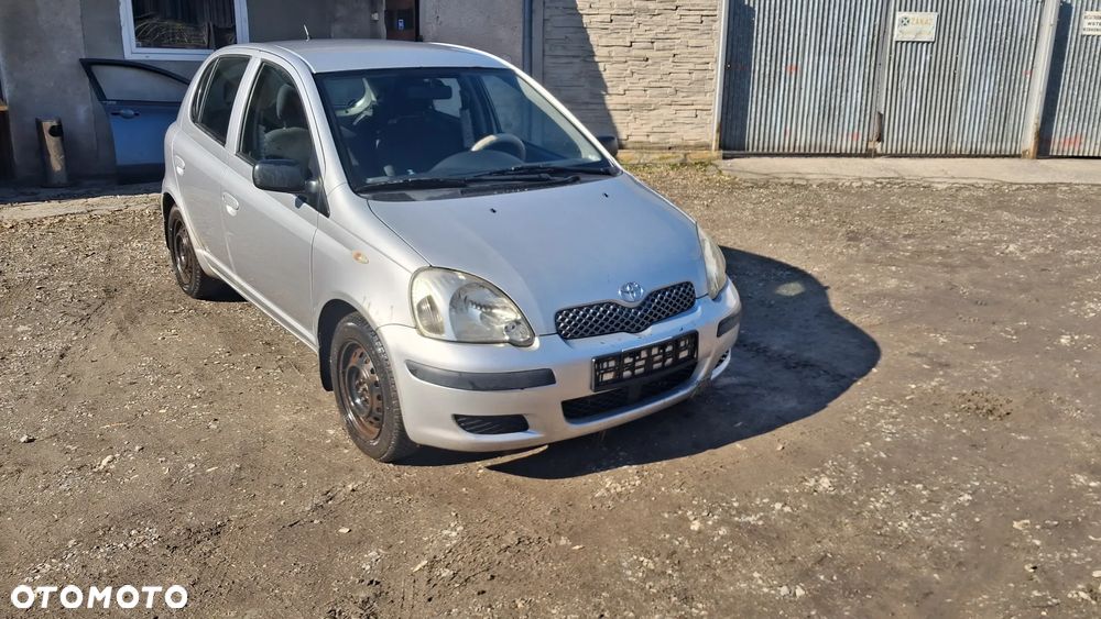 Na części Toyota Yaris I LIFT silnik 1.0 1SZ-FE , 1.3 VVY-i 2SZ-FE lakier 1E7 skrzynia maska zderzak drzwi klapa szyba fotel kanapa lusterko lampa - 1