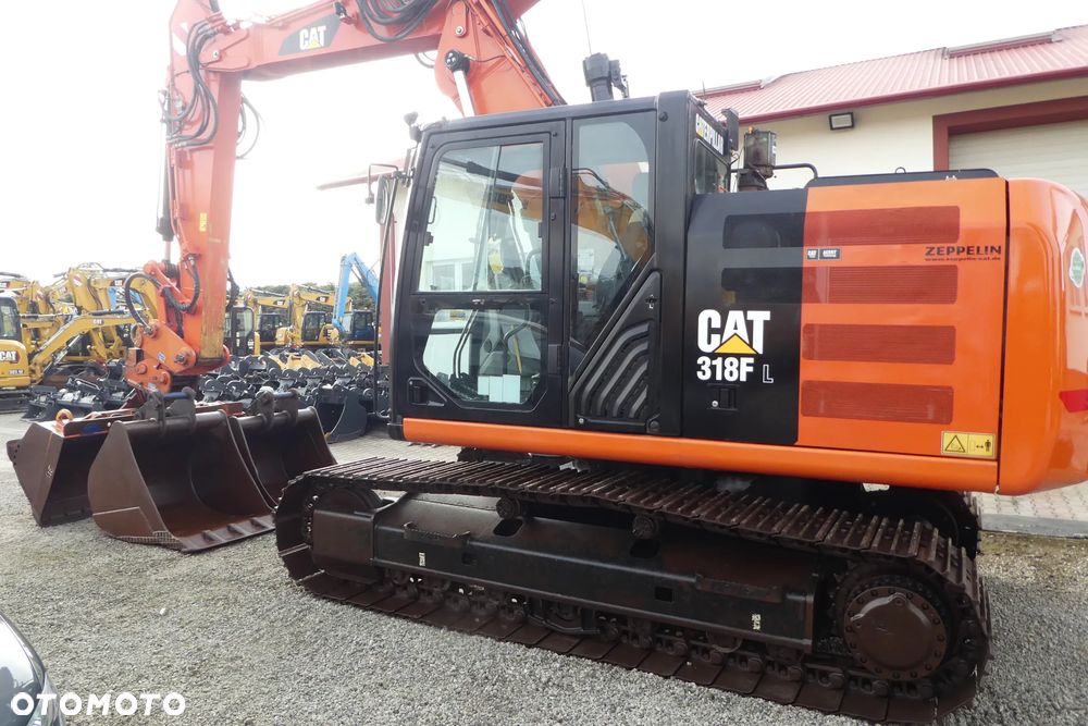 Caterpillar M 318F Z NIEMIEC TRZY ŁYŻKI - 37