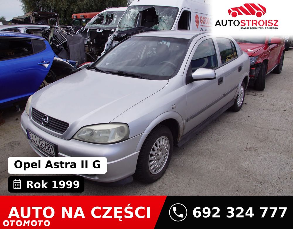 Auto na części - Opel Astra II G 1.6 16V 101 KM X16XEL F17 Z147 1999R Silnik Skrzynia Drzwi Maska Błotnik Zderzak Klapa Lampa Lusterko Klamka Szyba Deska Kokpit Sterownik Moduł Czujnik Licznik Panel Kierownica - 1