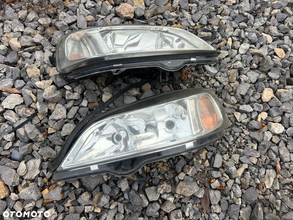 KL Lampa Przód Lewa Prawa Lewy Prawy Przód Opel Astra G 98- TYC