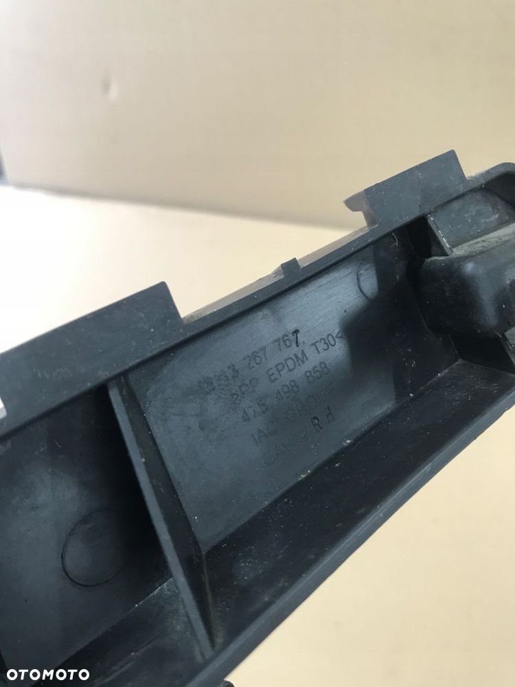 OPEL MERIVA B ŚLIZG WSPORNIK POD LAMPĘ PRAWY LUB LEWY GM - 16