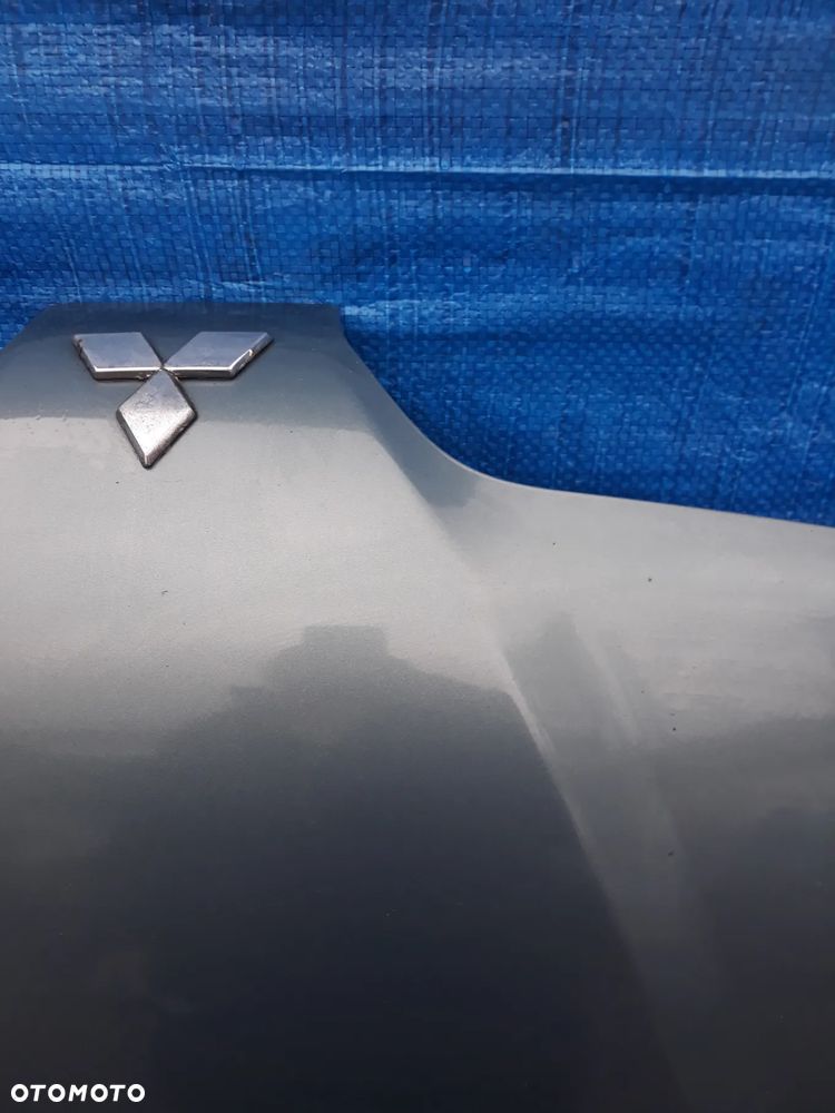 MASKA MITSUBISHI CARISMA  KOLOR: G64  2002r - 5