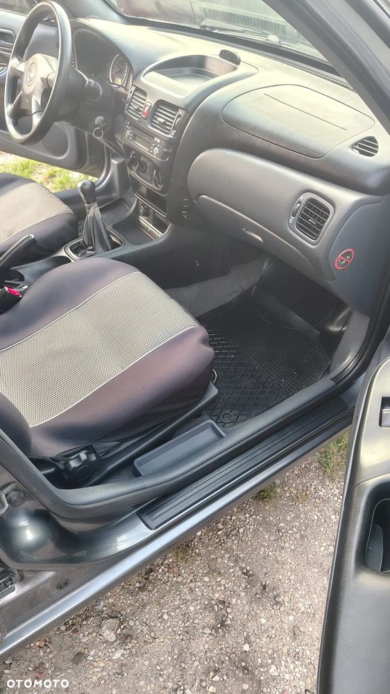 Nissan Almera 1.5 Visia + - 10