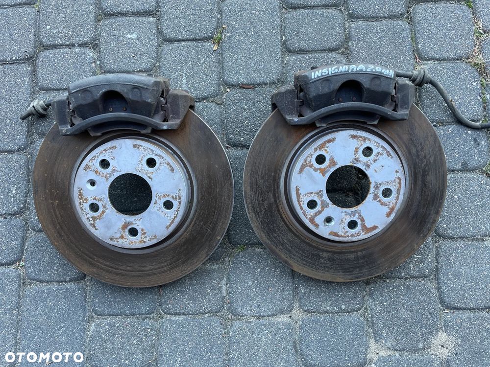 Opel Insignia A ZACISKI HAMULCOWE TARCZE KLOCKI KOMPLET PRZÓD 321 TYŁ 292