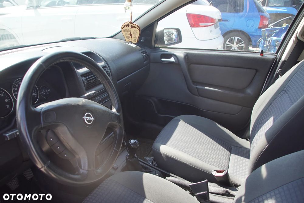 Auto na części - Opel Astra II G 1.6 16V 101 KM Z16XE F17 Z157 2002R Silnik Skrzynia Drzwi Maska Błotnik Zderzak Klapa Lampa Lusterko Klamka Szyba Deska Kokpit Sterownik Moduł Czujnik Licznik Panel Kierownica - 12