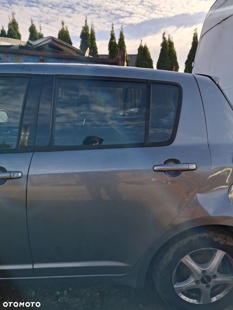 Suzuki Swift 05 drzwi lewy tyl ZCD - 1