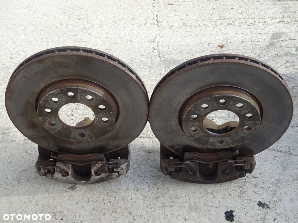 OPEL ZAFIRA B ASTRA H ZACISK PRAWY LEWY PRZÓD JARZMO ZACISKI PRZEDNIE 57/25 280mm - 11