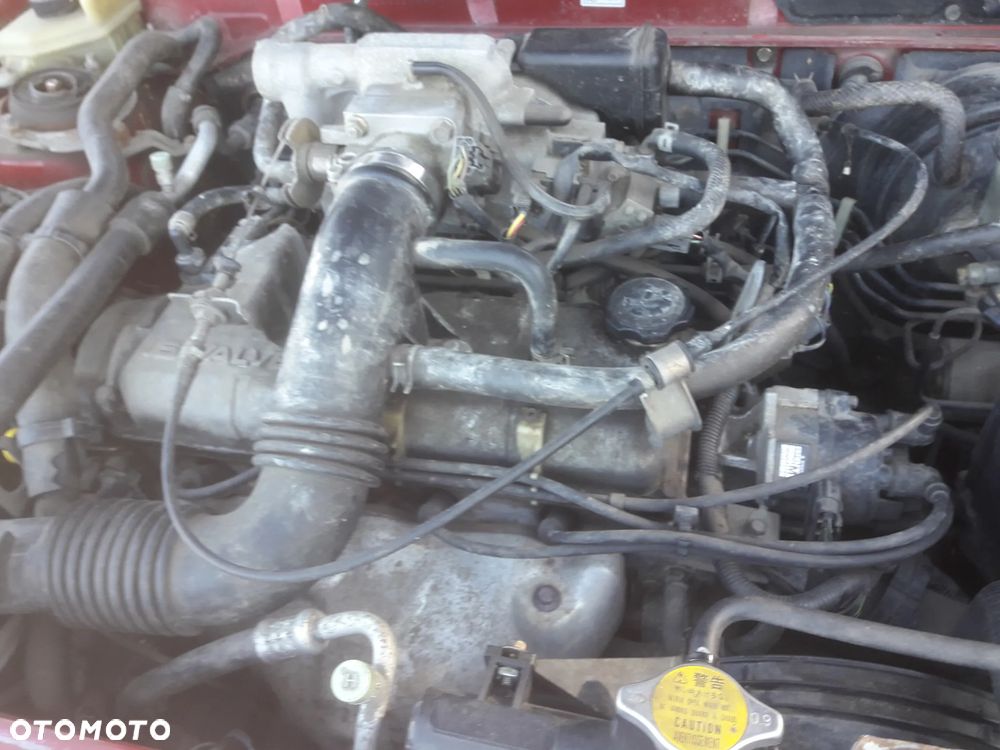 Mazda Demio 97-Klapa Zderzak tylny szybapas  lampa belka Kolor SU - 12