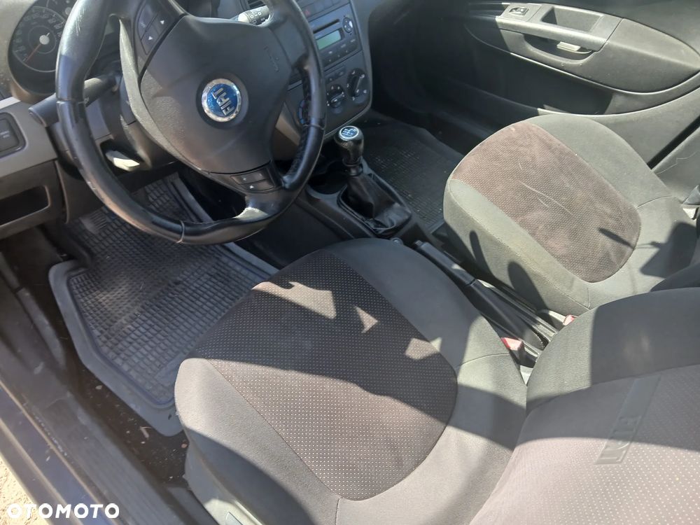 Fiat Grande punto 5d 1.2 MPI 8V CF4 65km 199 A4.000 silnik skrzynia napęd sanki belka wahacz wahacze zacisk zaciski zwrotnica piasta kopyto mc person amortyzator - 12
